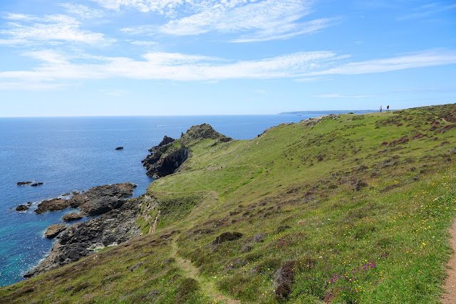 Cudden Point, with sea in the background and lots of rocks at the bottom.